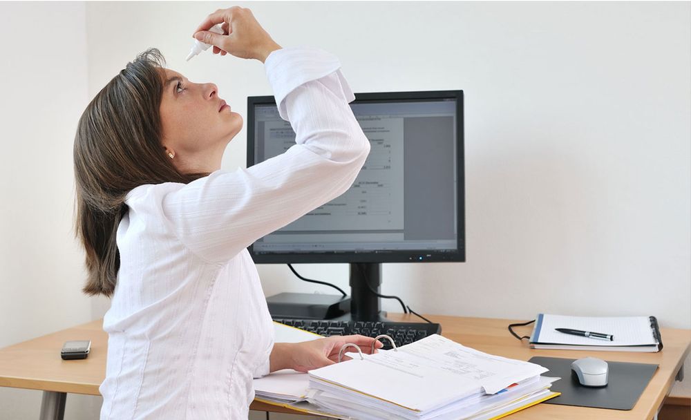 Woman Using Eye Dropper