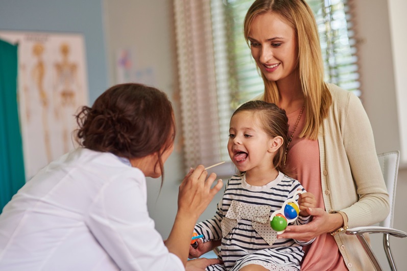 Child getting a doctor checkup