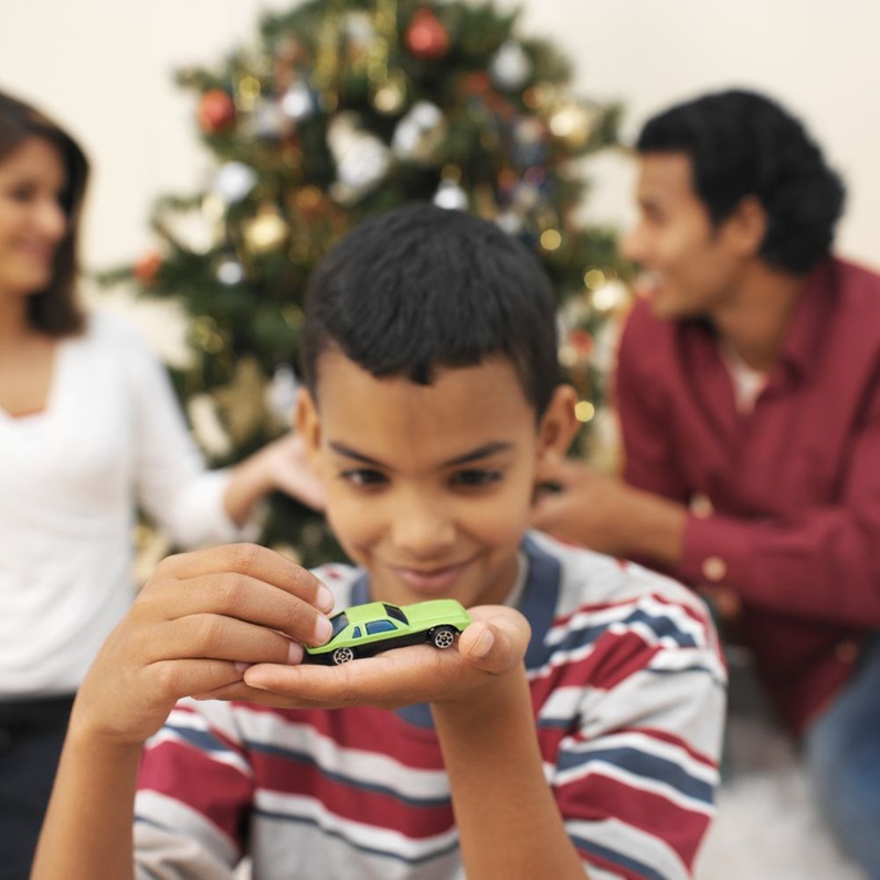 Child holding a toy car