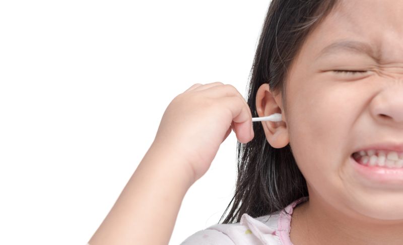 Kid Using a Cotton Swab